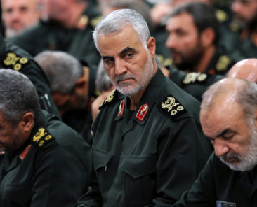 FILE - In this Sept. 18, 2016 file photo released by an official website of the office of the Iranian supreme leader, Revolutionary Guard Gen. Qassem Soleimani, center, attends a meeting with Supreme Leader Ayatollah Ali Khamenei and Revolutionary Guard commanders in Tehran, Iran. Iran's Revolutionary Guard is warning Islamic State militants that missile attacks launched into eastern Syria the previous day can be repeated if the extremists take action against Iran's security. (Office of the Iranian Supreme Leader via AP)