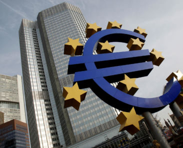 FILE PHOTO: A sculpture showing the Euro currency sign is seen in front of the European Central Bank (ECB) headquarters in Frankfurt, December 8, 2011. REUTERS/Alex Domanski/File Photo - RC1A5F89B620