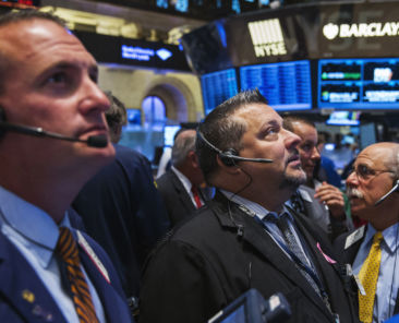 Traders work on the floor of the New York Stock Exchange shortly after the market's opening in New York July 28, 2014. REUTERS/Lucas Jackson (UNITED STATES - Tags: BUSINESS) - RTR40EIE