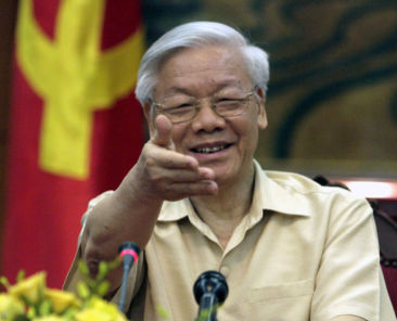 FILE - In this July 3, 2015 file photo, Vietnamese Communist Party General Secretary Nguyen Phu Trong gestures during a meeting with the Western press in Hanoi, Vietnam. Vietnam's Communist Party on Wednesday, Jan. 27, 2016, re-elected its 71-year-old chief for a second term, officials said, an expected outcome that sees the conservative pro-China ideologue cementing his hold on power. The party's congress elected Nguyen Phu Trong to a 19-member Politburo, the all-powerful body that handles the day-to-day affairs of the government and the party. In a subsequent vote, he was immediately chosen as the general-secretary, the de facto No. 1 leader of the country. (AP Photo/Tran Van Minh, File)