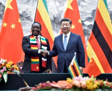 Chinese President Xi Jinping shakes hands with Zimbabwean President Emmerson Mnangagwa as they pose for the media after a signing ceremony at the Great Hall of the People in Beijing, China April 3, 2018. Parker Song/Pool via REUTERS