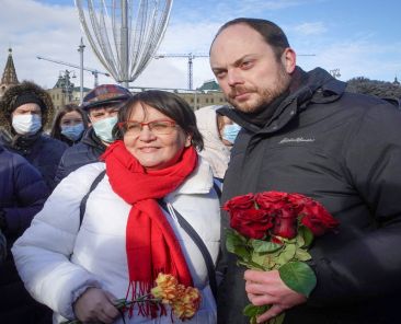 FILE PHOTO: Russian opposition figures Yulia Galyamina and Vladimir Kara-Murza place flowers at the site of the assassination of Russian opposition politician Boris Nemtsov while marking the 6th anniversary of Nemtsov's death, in central Moscow, Russia February 27, 2021. REUTERS/Tatyana Makeyeva/File Photo