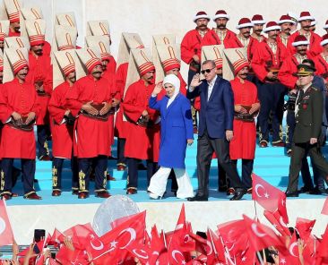 ISTANBUL, TURKEY - MAY 29: Turkish President Recep Tayyip Erdogan (Center R) and his wife Emine Erdogan (Center L) salute the participants attend the celebrations of the 563rd anniversary of Istanbuls conquest by Turks at Yenikapi Event Area in Istanbul, Turkey on May 29, 2016. On May 29, 1453, Ottoman Sultan Mehmed II (Mehmet the Conqueror) conquered Istanbul, then called Constantinople, from where the Byzantines had ruled the Eastern Roman Empire for more than 1,000 years. The conquest transformed the city, once the heart of the Byzantine realm, into the capital of the new Ottoman Empire. (Photo by Berk Ozkan/Anadolu Agency/Getty Images)
