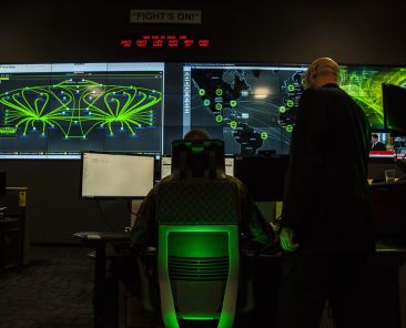 Marines with Marine Corps Forces Cyberspace Command pose for photos in the cyber operations center at Lasswell Hall aboard Fort Meade, Maryland, Feb. 5, 2020. MARFORCYBER Marines conduct offensive and defensive cyber operations in support of United States Cyber Command and operate, secure and defend the Marine Corps Enterprise Network. This image is a photo illustration.