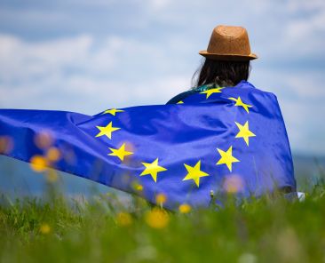 Young woman holding European Union flag. Voting, election concept.