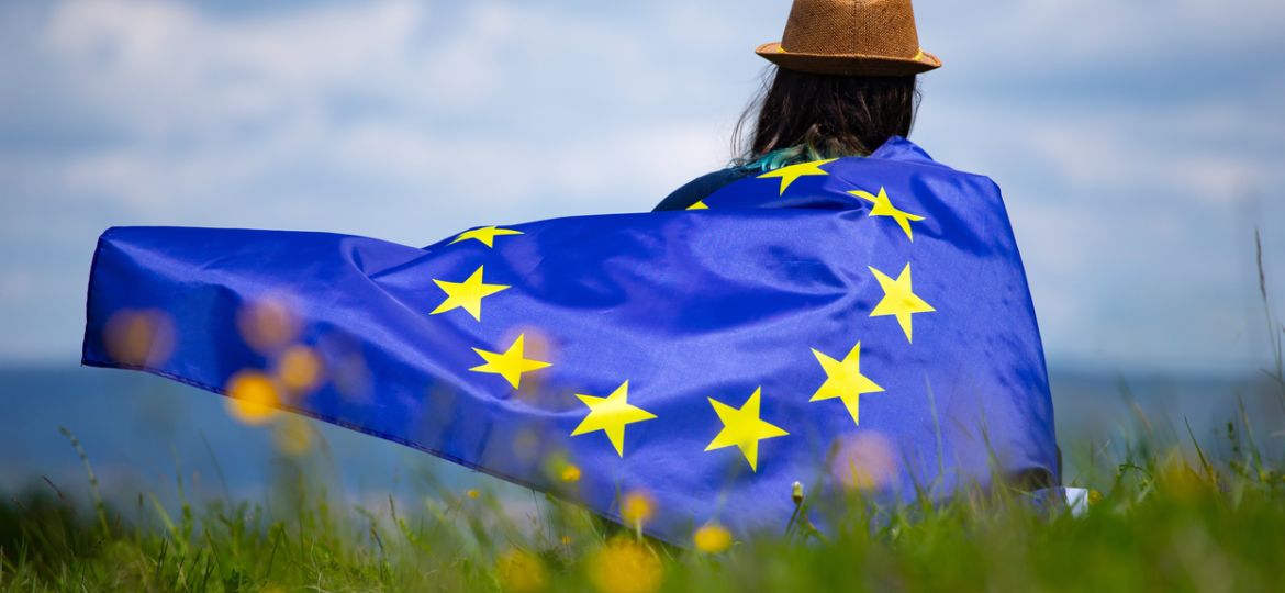 Young woman holding European Union flag. Voting, election concep