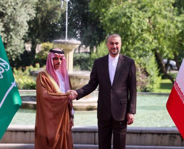 Iran's Foreign Minister Hossein Amir-Abdollahian (R) shakes hands with his Saudi counterpart Faisal bin Farhan in Tehran on June 17, 2023. (Photo by Atta KENARE / AFP) (Photo by ATTA KENARE/AFP via Getty Images)