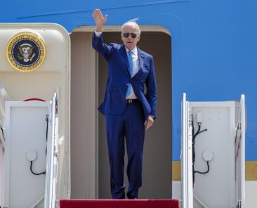 President Joe Biden waves as he boards Air Force One at Andrews Air Force Base, Md., Wednesday, May 17, 2023, as he heads to Hiroshima, Japan to attend the G-7. (AP Photo/Jess Rapfogel)