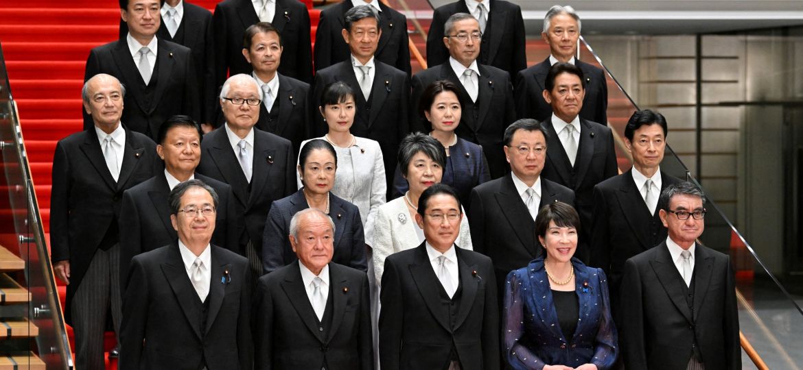 Japanese Prime Minister Fumio Kishida poses with his new cabinet at his official residence in Tokyo