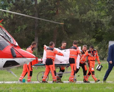 Rescue workers wheel Slovak Prime Minister Robert Fico, who was shot and injured, to a hospital in the town of Banska Bystrica, central Slovakia, Wednesday, May 15, 2024. Slovakia's populist Prime Minister Robert Fico is in life-threatening condition after being wounded in a shooting Wednesday afternoon, according to his Facebook profile. (Jan Kroslak/TASR via AP)